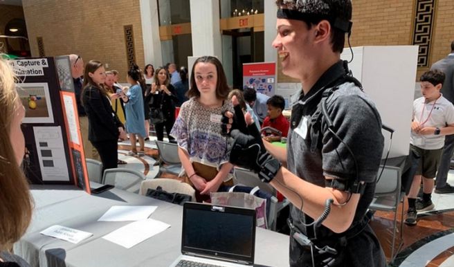 A student from Pembroke High School in Massachusetts wears the Perception Neuron motion capture suit. 